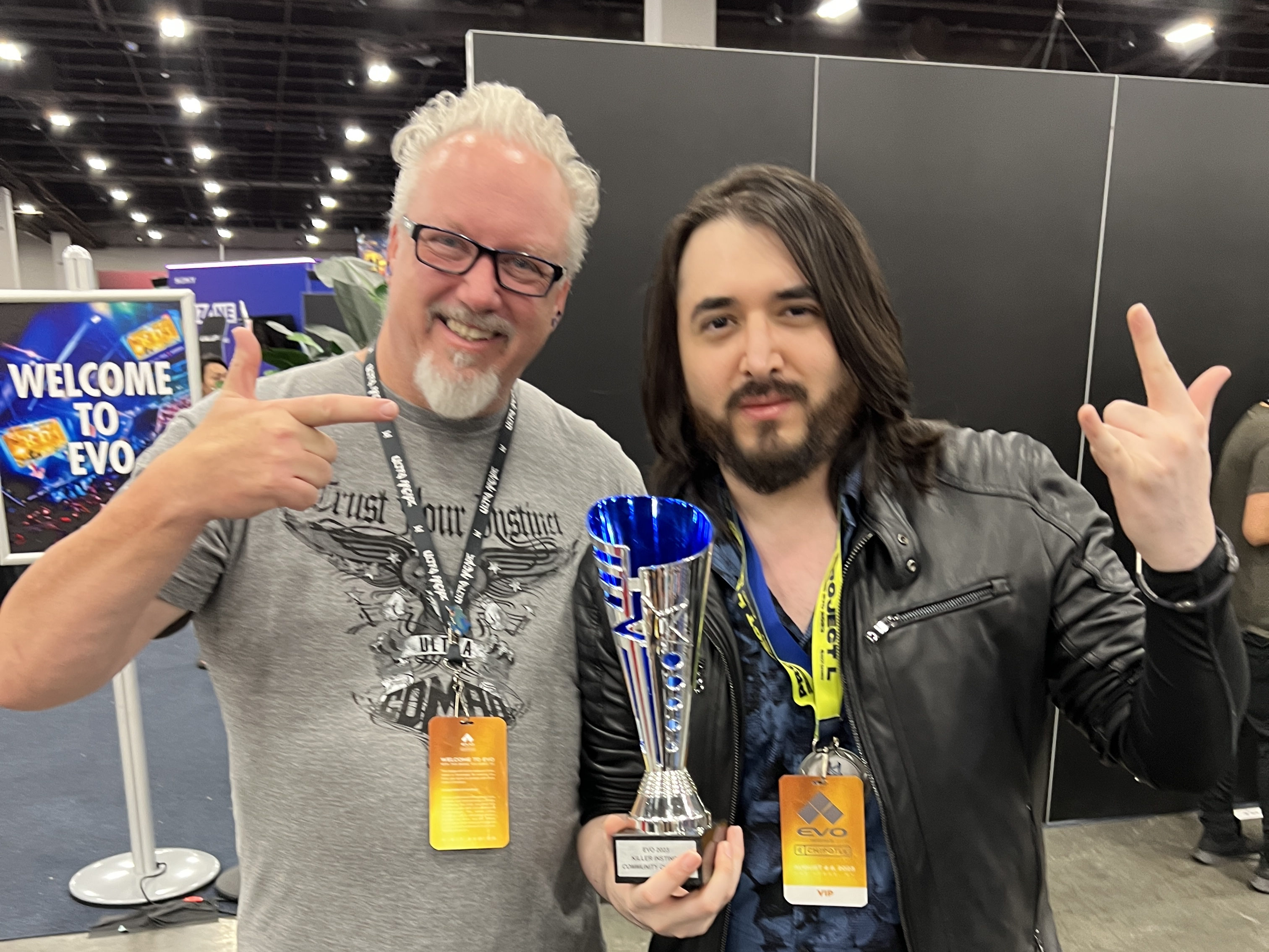 James Goddard and NotAlexV holding the Community Tournament trophy.